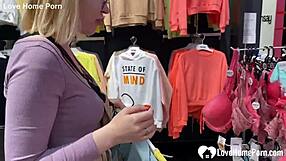 Beautiful blonde gives a perfect blowjob in the shop changing room