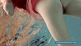 Teen Brunette Katya okuneva in red dress alone in the pool
