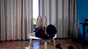 Pretty housewife in pantyhose undressing at a round table