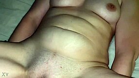 A MILF with a gaping pussy eats a cucumber