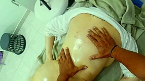 Young camgirl working in the massage room, showing off her curves