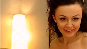 A brunette wears sexy lingerie and uses a sex toy on herself