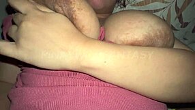 Close up of an Asian cutie sucking on big bouncy boobs with milk