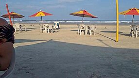 Beach heat with Latina fingering pussy for everyone to see