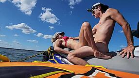 This athletic couple goes for outdoor sex on a jetski in the lake middle. She RIDES his big cock in cowgirl then bends over for doggystyle pounding.